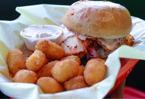 Francisco Kjolseth | The Salt Lake Tribune 
Chedda Burger's The Silly Round Eye, featuring beef patty, Swiss, pastrami, kimchi and fry sauce with Chedda tots.