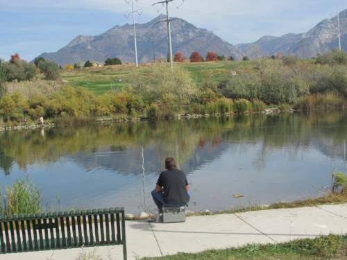 Tom Wharton  |  The Salt Lake Tribune

Randy Bennett enjoys an afternoon of fishing at Sandy Pond.