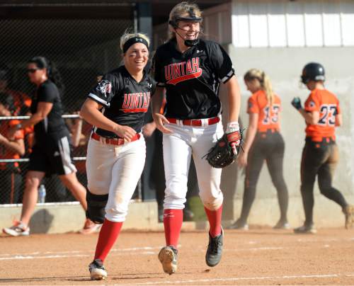 Steve Griffin / The Salt Lake Tribune

Uintah's Summer Stensgard and Jaden Lance celebrate their victory over Murray in the first round of the Class 4A softball tournament in Murray Tuesday May 17, 2016.