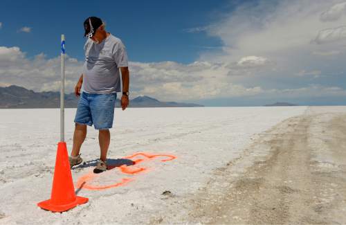Leah Hogsten  |  The Salt Lake Tribune
"If we tried to run a race, we'd be looking for an accident," said Dennis Sullivan, president of the Utah Salt Flats Racing Association or USFRA. Sullivan kicks at the dangerously thin, popcorn-like salt on Course #2 that reveals unstable dirt below that is hazardous for driving upon at such high speeds.  There are four "courses" on the Bonneville Salt Flats used by the Utah Salt Flats Racing Association, but only the two longest--Course #1 or the "Short" course that is 3-5-miles and Course #2 or the "Long" Course that is 5-7-miles--are operational during Speed Week. Poor salt conditions at the Bonneville Salt Flats have led to the cancellation of many recent land-speed racing events. Many factors contribute to lack of salt on the flats, including weather conditions; racers say that mineral extraction also diverts salt and water.