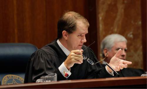 In this photo taken Sept. 1, 2015, Texas Supreme Court Justice Don Willett speaks in Austin, Texas. Presumptive Republican presidential nominee Donald Trump has released a list of 11 potential Supreme Court justices he plans to vet to fill the seat of late Justice Antonin Scalia.  (AP Photo/Eric Gay)
