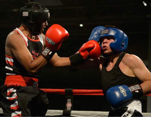 Leah Hogsten  |  The Salt Lake Tribune
 Salt Lake City's Bladimir Estrada (left), a West High senior, was defeated by Rafael Medina of Texas
during the second round of the 2016 National Golden Gloves Tournament of Champions boxing tournament at the Salt Palace Convention Center on Tuesday, May 17, 2016.