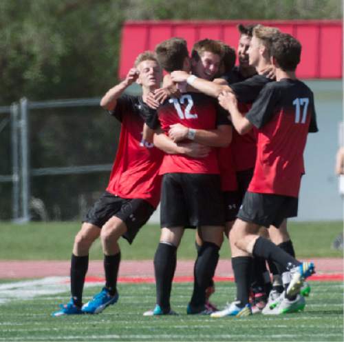 Steve Griffin / The Salt Lake Tribune

Alta's Zachary Maas (#12) IS mobbed by his teammates after scoring the only goal of the match during the first-round 4A boys' soccer tournament between Alta and East at East High School in Salt Lake City Wednesday May 18, 2016.