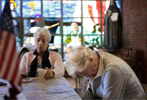 In this Monday, May 16, 2016 photo ,Mary Fernandes, left, and Nancy Shilts, right, parishioners at St. Frances X. Cabrini church are emotional while talking about the closing of the church, in Scituate, Mass. Now that the U.S. Supreme Court has refused to hear their last-ditch appeal, parishioners who have occupied the Roman Catholic church for 11 years in defiance of the Boston archdiocese's order to close it are vowing to create an independent church outside the Vatican's control. (AP Photo/Steven Senne)