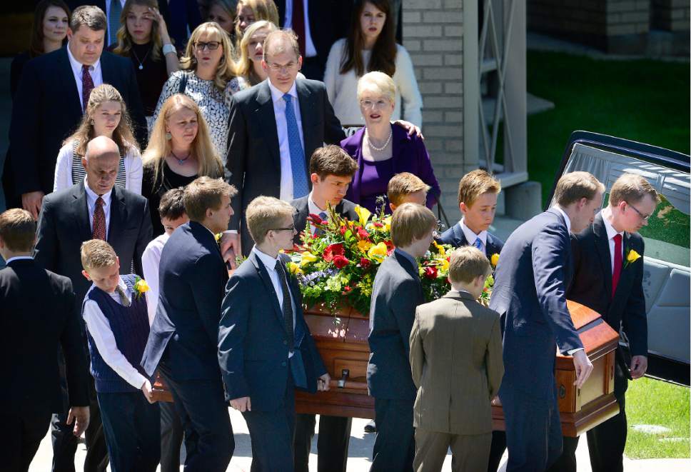 Scott Sommerdorf   |  The Salt Lake Tribune  
Friends and family watch as former U.S. Senator Bob Bennett's casket is taken from the Federal Heights Ward Chapel for it's short trip to interment services at the Salt Lake City Cemetery, Saturday, May 14, 2016.