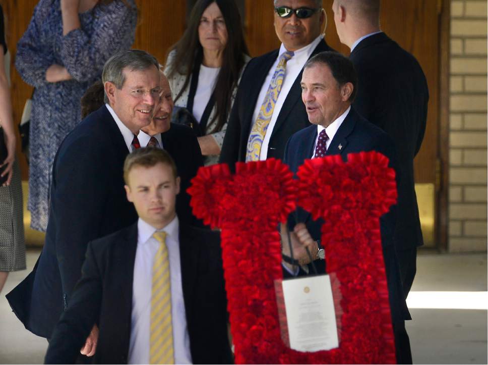 Scott Sommerdorf   |  The Salt Lake Tribune  
Former Utah Governor Mike Leavitt, left, and Utah Governor Gary Herbert chat as flowers are brought out from the funeral services for former U.S. Senator Bob Bennett on Saturday.