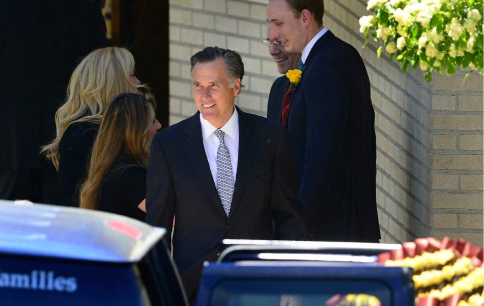 Scott Sommerdorf   |  The Salt Lake Tribune  
Mitt Romney leaves the funeral services for former U.S. Senator Bob Bennett on Saturday.