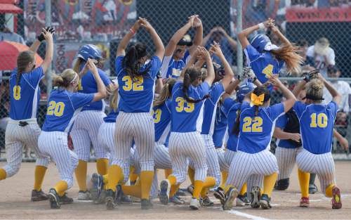 Francisco Kjolseth | The Salt Lake Tribune
Taylorsville teammates celebrate a home run by Tayah Gerber #4, against West in the quarterfinals of the Class 5A softball tournament on Thursday, May 19, 2016 at West.
