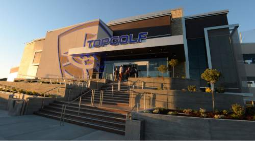 Steve Griffin | The Salt Lake Tribune

Golfers get their first swing recently at TopGolf in Midvale. The facility is part sports venue/part restaurant and bar. Guests hit golf balls with computer microchips that track each shot's accuracy and distance.