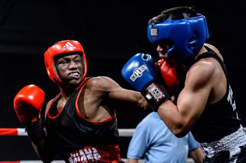 Trent Nelson  |  The Salt Lake Tribune
E'mond Driver, Indiana (red), vs. Rafael Medina, Texas, in boxing action at the Golden Gloves of America's 2016 National Tournament of Champions in Salt Lake City, Thursday May 19, 2016.