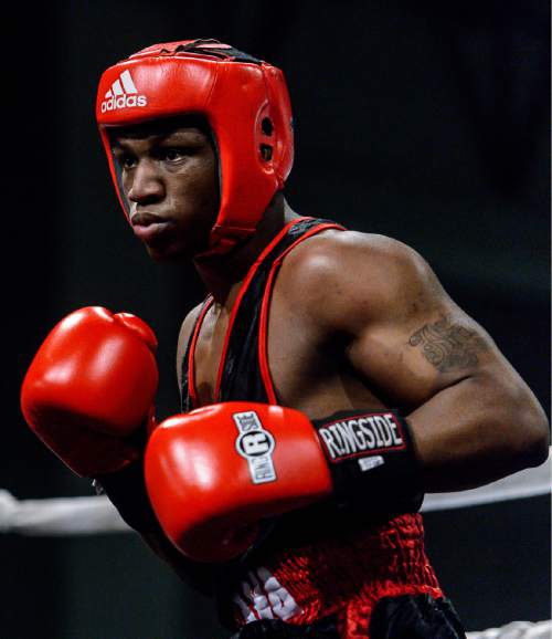 Trent Nelson  |  The Salt Lake Tribune
E'mond Driver, Indiana (red), vs. Rafael Medina, Texas, in boxing action at the Golden Gloves of America's 2016 National Tournament of Champions in Salt Lake City, Thursday May 19, 2016.