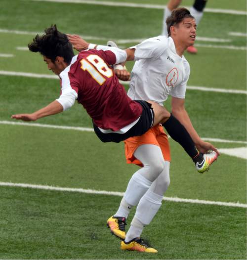 Steve Griffin / The Salt Lake Tribune

Mountain View's Elder Aguayo gets sent flying with a hip check from Murray's CJ Sanchez during the 4A boys' soccer quarterfinals in Murray Friday May 20, 2016. Sanchez was whistled for a foul on the play.