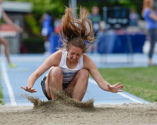 Francisco Kjolseth | The Salt Lake Tribune
Mykelle Coats of Sky View drops in to the sand in the Girl's long jump 5A final, as boys and girls high school athletes compete in the 5A-1A state track & field meet compete at BYU in Provo on Friday, May 20, 2016.