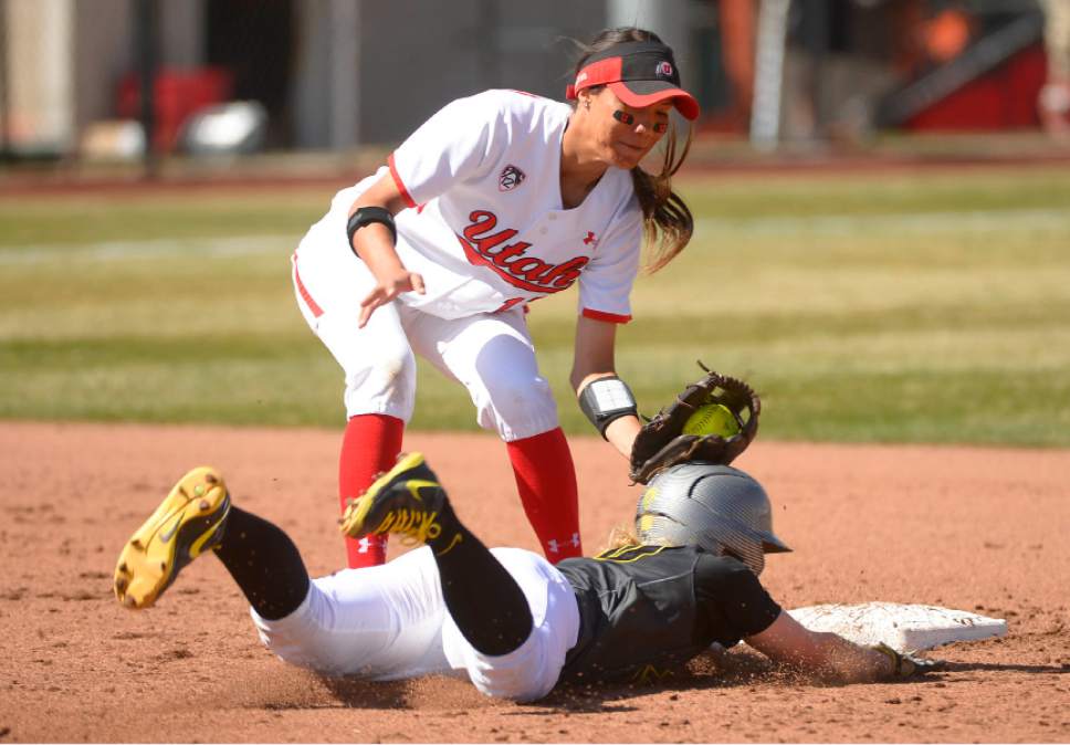 Leah Hogsten  |  The Salt Lake Tribune
Utah's Anissa Urtez outs Oregon's Jenna Lilley at second. The University of Utah softball team was defeated during their home debut, Saturday, by Oregon, 4-2, March 21, 2015 .