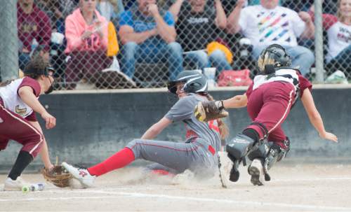 Rick Egan  |  The Salt Lake Tribune

Juab catcher Taylei Williams (5) tries to tag out Keagan Summers (20) Bear River, ras she scores the tying run in the 7th inning in softball action Baer River vs. Juab, in the 3A state title game, Saturday, May 21, 2016.