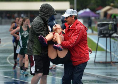 Scott Sommerdorf   |  The Salt Lake Tribune  
A runner was carried off the track after passing out during the Girl's 3200M 1A race at the second day of the state high school track & field meet at BYU, Saturday, May 21, 2016.