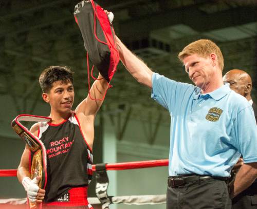 Rick Egan  |  The Salt Lake Tribune

Diego Alverez (left) Rocky Mountain with his championship belt after defeating , Fernando Martinez, Nevada, in the 114 division, in the 2016 Golden Gloves Tournament of Champions, at the Salt Palace, Saturday, May 21, 2016.