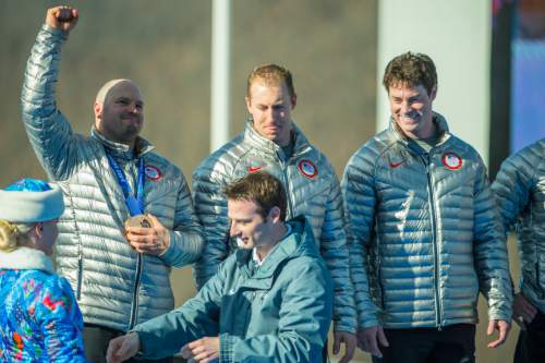 KRASNAYA POLYANA, RUSSIA  - JANUARY 23:
USA's Steven Holcomb, Chris Fogt, Curtis Tomasevicz, and Steve Langton, celebrate during the medal ceremony at the finish of the four-man bobsled at Sanki Sliding Center during the 2014 Sochi Olympics Sunday February 23, 2014. They won the bronze medal with a cumulative time of 3:40.99. 
(Photo by Chris Detrick/The Salt Lake Tribune)