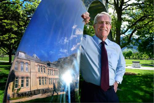 Scott Sommerdorf   |  The Salt Lake Tribune  
USU President Stan Albrecht leans against the reflective "Sojourn sculpture" near the Old Main building, Wednesday, May 18, 2016. He is retiring from his position with the University.
