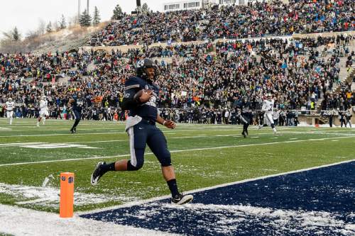 Trent Nelson  |  The Salt Lake Tribune
Utah State Aggies quarterback Chuckie Keeton (16) runs for a touchdown as Utah State hosts BYU, NCAA football in Logan, Saturday November 28, 2015.