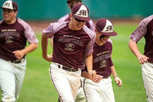 Chris Detrick  |  The Salt Lake Tribune
Maple Mountain's Jeff Mack (8) chases teammate Jarrett McAllister (6) around the field in between innings during the 4A quarterfinal baseball game against Orem at Utah Valley University Tuesday May 24, 2016.