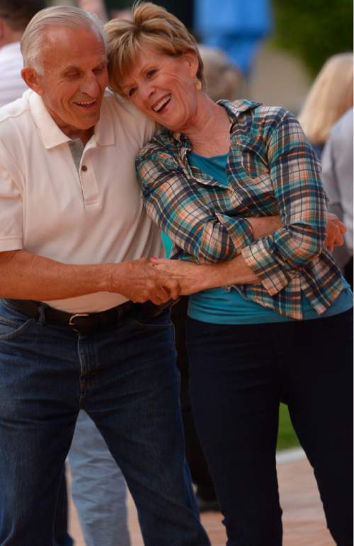 Leah Hogsten  |  The Salt Lake Tribune
Keith and DeAnn Hardy of Cottonwood Heights twirl around the parquet flooring to the Big Band Summer event at Gallivan Center, Tuesday, May 24, 2016 with City Jazz Big Band and singer, Katrina Cannon. The event is the first in a series of 17 Tuesday night dances. Along with City Jazz Big Band,  other bands such as Wasatch Jazz Project, Caleb Chapman's Crescent Super Band, and Tad Calcara & New Deal Swing (to name a few) will be featured. The Gallivan Center sets up a large outdoor dance floor. All these events are free.