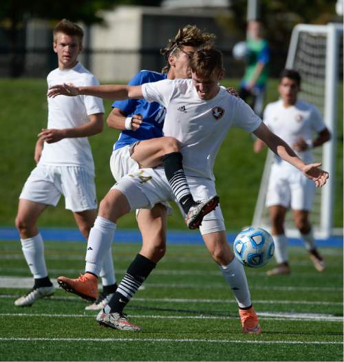 Francisco Kjolseth | The Salt Lake Tribune
Orem's Brando Cardona, left, battles Tanner Gill of Maple Mountain in game action in Draper for the Class 4A boys' soccer championship.