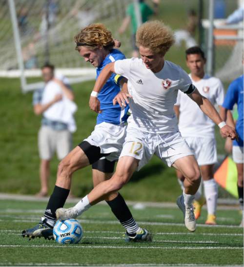 Francisco Kjolseth | The Salt Lake Tribune
Orem's Braden Patten, left, battles Aiden Dayton of Maple Mountain in game action in Draper for the Class 4A boys' soccer championship.