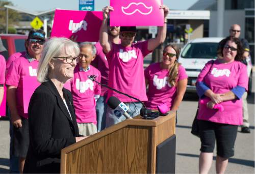 Rick Egan  |  Tribune file photo
Salt Lake City International Airport Director Maureen Riley, surrounded by Lyft drivers, announced changes to the City's airport ground-transportation rules at Salt Lake City International Airport, Thursday, September 10, 2015. Ride-hailing companies have since taken off at the airport -- capturing 25 percent of the market in recent months.