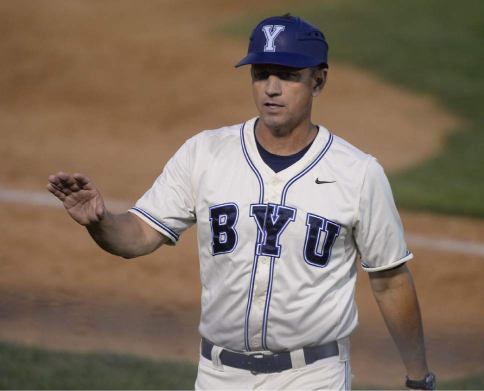 Steve Griffin  |  The Salt Lake Tribune

BYU coach Mike Littlewood talks to his players on the bench from his third base coach position during the BYU and Utah baseball game at BYU in Provo, Tuesday, April 21, 2015.