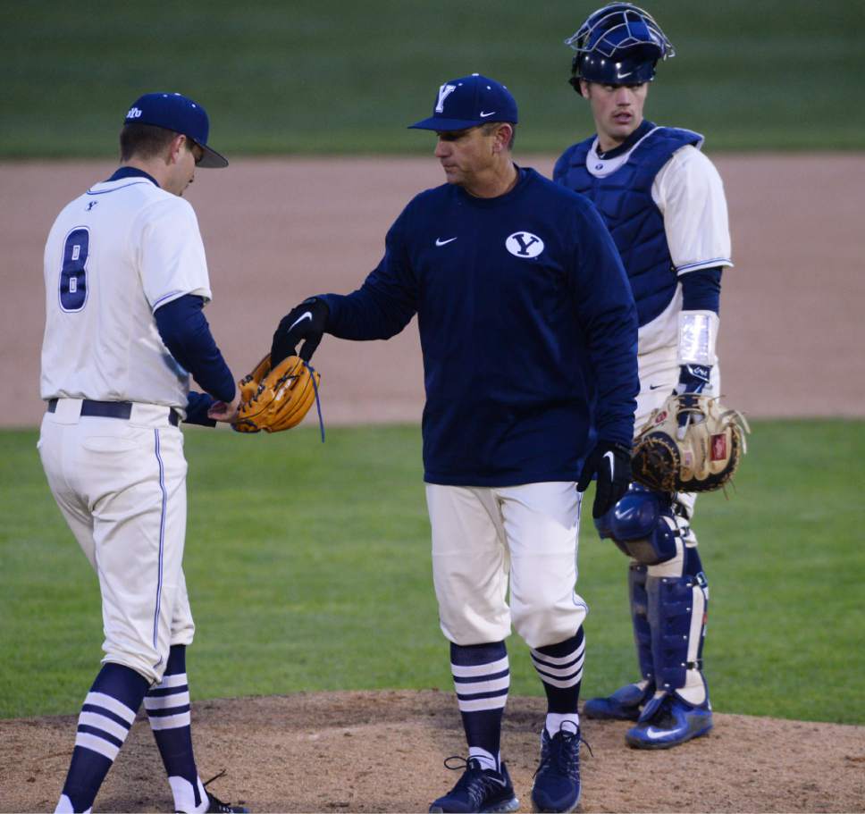 Steve Griffin  |  The Salt Lake Tribune


BYU baseball coach Mike Littlewood hands the ball to pitcher Keaton Cenatiempo during game against Utah in at Miller Park on the campus of BYU in Provo, Tuesday, March 15, 2016.
