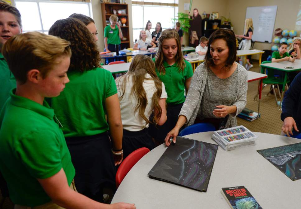 Francisco Kjolseth | The Salt Lake Tribune 
Andrea Hart, a 6th grade Humanities teacher at Ascent Academy in Farmington works with students during a recent art project.