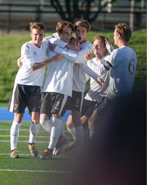 Francisco Kjolseth | The Salt Lake Tribune
Viewmont's Drake Cook, second from left, is celebrated by teammates after scoring a goal over Fremont in Draper for the Class 5A boys' soccer championship. Viewmont won 4-2.