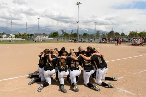 Trent Nelson  |  The Salt Lake Tribune
Maple Mountain players kneel in prayer before losing to Spanish Fork in the 4A high school softball championship game, Taylorsville, Thursday May 26, 2016.