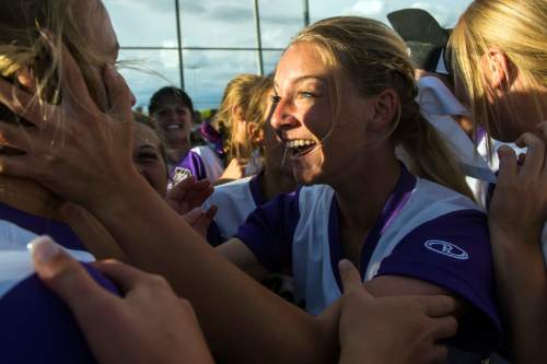 Chris Detrick  |  The Salt Lake Tribune
Members of the Riverton softball team celebrate after winning the 5A championship game at Valley Regional Softball Complex Thursday May 26, 2016. Riverton defeated West 13-11.