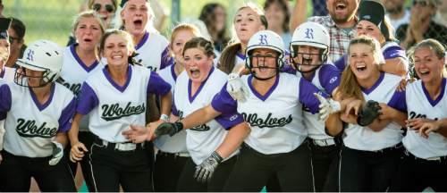 Chris Detrick  |  The Salt Lake Tribune
Members of the Riverton softball team celebrate as Taylor Eakle (14) crosses home plate after hitting the game winning home-run in the bottom of the seventh inning during the 5A championship game at Valley Regional Softball Complex Thursday May 26, 2016. Riverton defeated West 13-11.