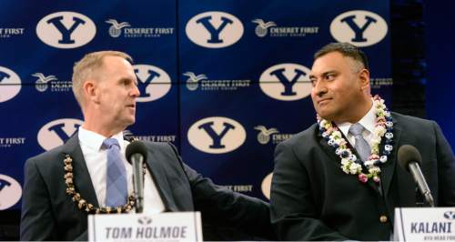 Al Hartmann  |  The Salt Lake Tribune
BYU Athletic Director Tom Holmoe, left, announces Kalani Sitake as BYU's new head coach at a press conference in Provo Monday Dec. 21.