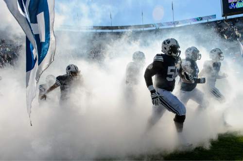 Trent Nelson  |  The Salt Lake Tribune
BYU players storm out of the fog as BYU hosts Wagner, NCAA football at LaVell Edwards Stadium in Provo, Saturday October 24, 2015.