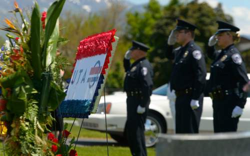 Leah Hogsten  |  The Salt Lake Tribune
Some 100 Utah Transit Authority employees honored one of the fellow co-workers, electrician Kay Ricks, 63, who was laid to rest Saturday, May 28 at Lehi City Cemetery after his funeral at American Fork West Stake. Utah police continue gathering evidence that could link two men who fled to Wyoming, after tying up and assaulting a mother and her four teenage daughters in a Centerville home on May 10, to the slaying of Ricks employee whose body was found in rural Wyoming.
