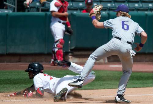 Steve Griffin / The Salt Lake Tribune

Utah's Andre Jackson gets tagged out at third by Washington's Chris Baker after knocking in three runs on a bases loaded hit during first game of a series against Washington for the Pac-12 title and an NCAA berth at Smith's Ballpark  in Salt Lake City Friday May 27, 2016. Washington defeated Utah 5-4.