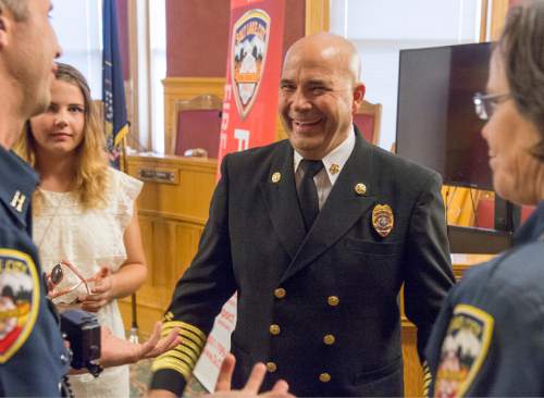 Rick Egan  |  The Salt Lake Tribune

Chief Brian Dale visits with family, friends and colleagues after being sworn in as the new Salt Lake City fire chief at City Hall, Thursday, June 4, 2015.