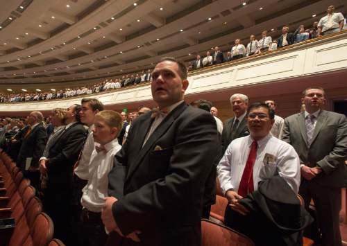 Rick Egan  |  The Salt Lake Tribune

LDS faithful stand as they join the choir in singing a hymn, during the 185th Annual LDS General Conference Priesthood Session, Saturday, April 4, 2015.