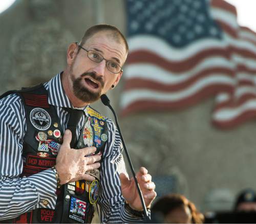 Rick Egan  |  The Salt Lake Tribune

Army Master Sgt. Gordon Ewell, author and Bronze Star, Purple Heart and Combat Action Badge recipient, speaks at the West Jordan Memorial Day service at Veterans Memorial Park, Monday, May 30, 2016.