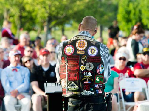 Rick Egan  |  The Salt Lake Tribune

Army Master Sgt. Gordon Ewell, author and Bronze Star, Purple Heart and Combat Action Badge recipient, speaks at the West Jordan Memorial Day service at Veterans Memorial Park, Monday, May 30, 2016.