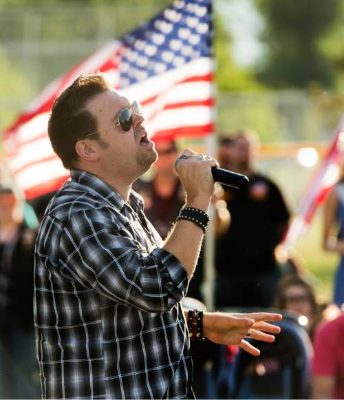 Rick Egan  |  The Salt Lake Tribune

Nathan Osmond sings during the West Jordan Memorial Day service at Veterans Memorial Park, Monday, May 30, 2016.