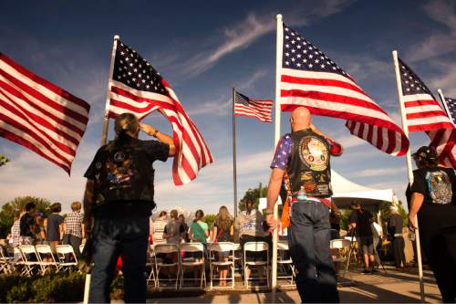 Rick Egan  |  The Salt Lake Tribune

Patriot Guard Riders salute the flag as it is raised, during the West Jordan Memorial Day service at Veterans Memorial Park, Monday, May 30, 2016.
