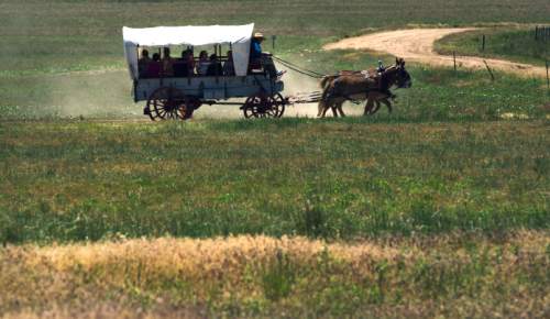 Steve Griffin / The Salt Lake Tribune

Mules pull covered wagons at the Fielding Garr Ranch on Antelope Island Monday May 30, 2016. The celebration of the West featured  music, poetry, wagon rides, children's activities, food.