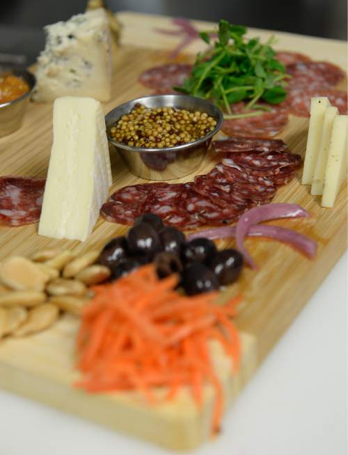 Francisco Kjolseth | The Salt Lake Tribune
Good Grammar Bar along Gallivan Avenue in downtown Salt Lake City offers menu options, including the charcuterie board with artisan meat, cheese and accoutrements.