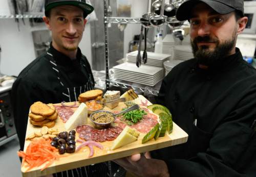 Francisco Kjolseth | The Salt Lake Tribune
Good Grammar Bar along Gallivan Avenue in downtown Salt Lake City offers menu options, including the charcuterie board with artisan meat, cheese and accoutrements. Pictured, chef de cuisine Alex Vastardis, left, and executive chef Neal Henderson.