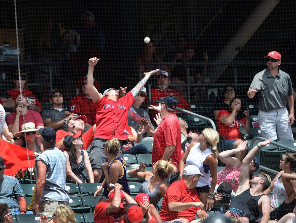 Scott Sommerdorf   |  The Salt Lake Tribune  
Utah fans try for a foul ball during one of Utah's five-run innings. Utah wins the Pac-12 baseball championship by defeating Washington 21-7, Sunday, May 29, 2016.